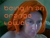 Leslie Michel, in an Orange Towel, as a Surreal Seer